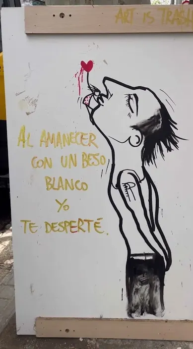 Figure and a dawn poem – Barcelona urban artist Art Is Trash Board with a painted figure and a poetic line about dawn, Barcelona, Art Is Trash