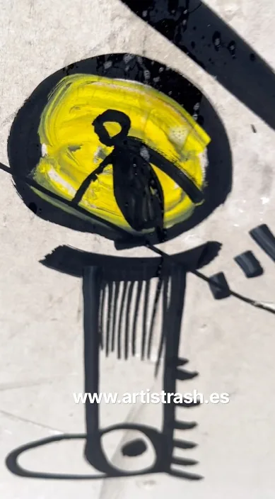 Painted figure in black and yellow, Barcelona, Art Is Trash