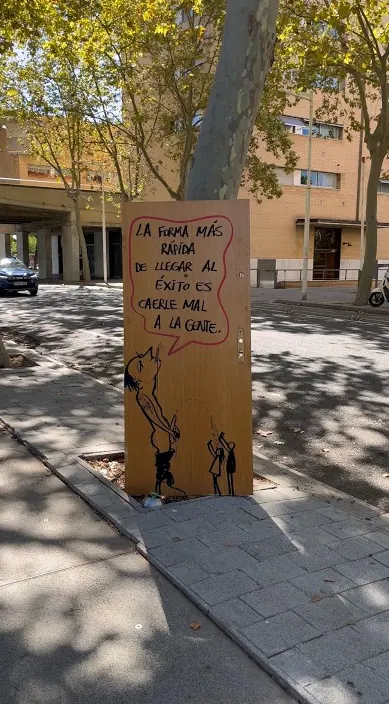 Board with a saying on success – street art by Art Is Trash Wooden board with a saying about success, standing in the street, Barcelona, Art Is Trash