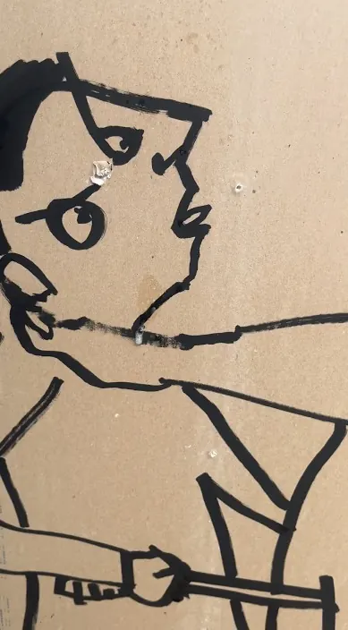 Black line figure on cardboard «Fútbol» – urban art Barcelona Black line drawing of a figure on a piece of cardboard, «Fútbol», Barcelona, Art Is Trash