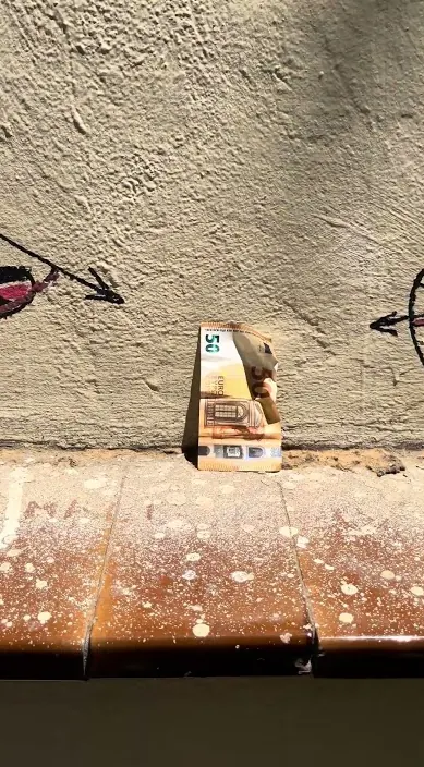 Cardboard box drawing, ledge – urban art Barcelona: Art Is Trash Small cardboard box with a drawing, left on a street ledge, Barcelona, Art Is Trash