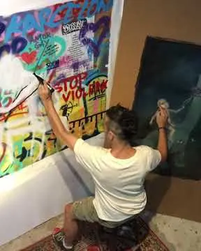 Pintando a dos manos Pintando a dos manos – street art in Barcelona: scene from the Art Is Trash video by Francisco de Pájaro