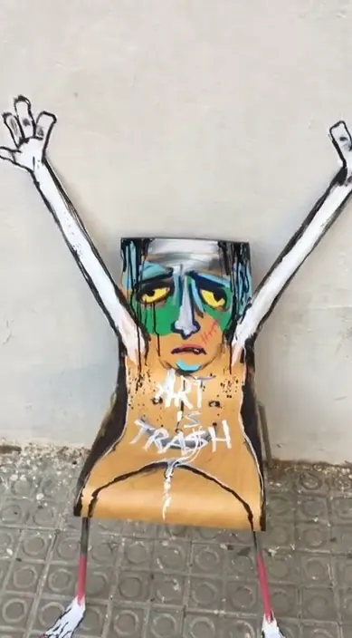 Silla indignada – street art in Barcelona: scene from the Art Is Trash video by Francisco de Pájaro