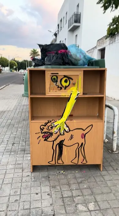 Cabinet painted with a dog – street art in Zafra by Art Is Trash Old cabinet painted with a dog, left on a street in Zafra, Art Is Trash